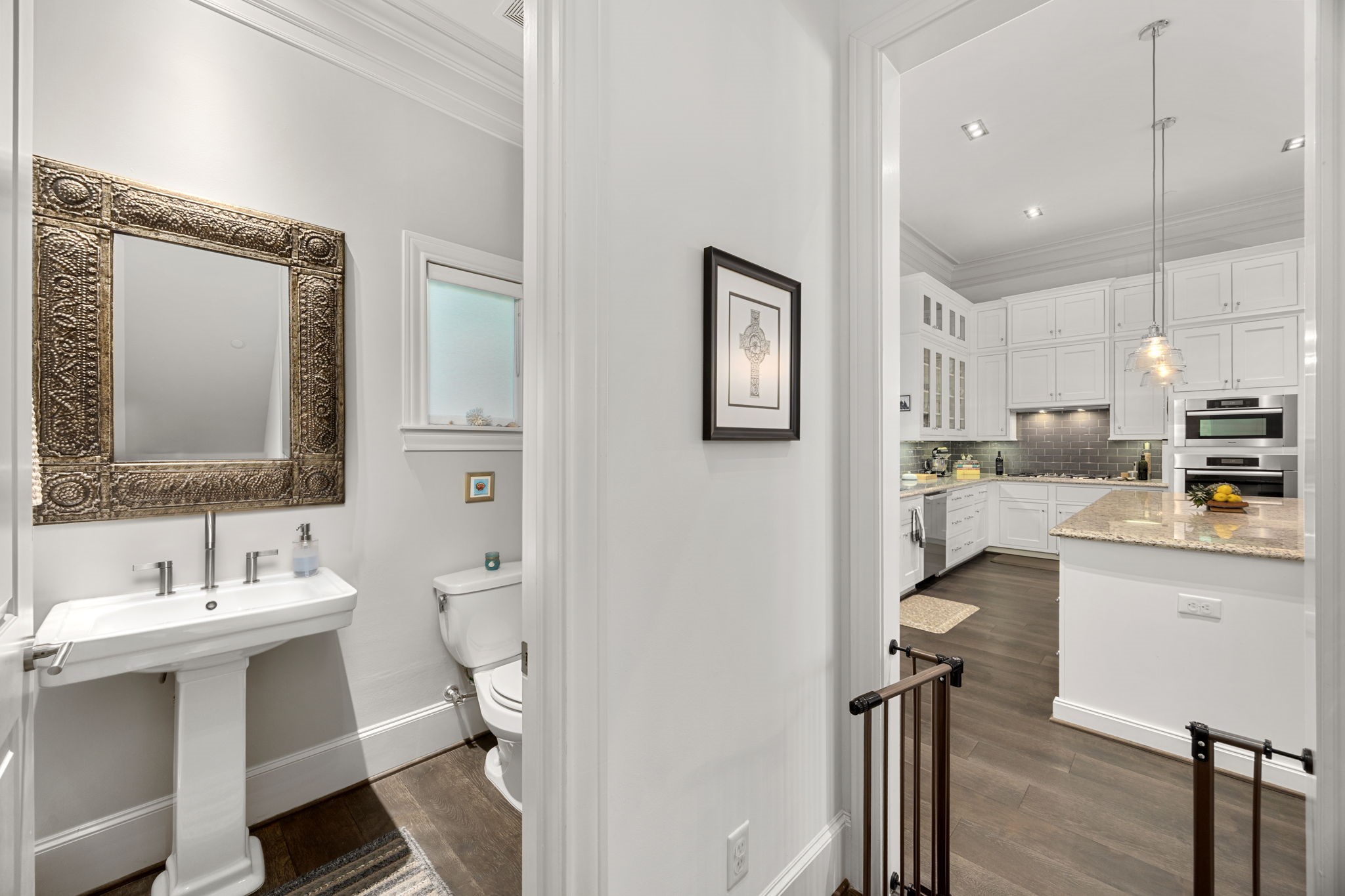 11 Robita Street Houston, TX 77019 - Photo 17 of 32 a bathroom with a sink a mirror and a toilet