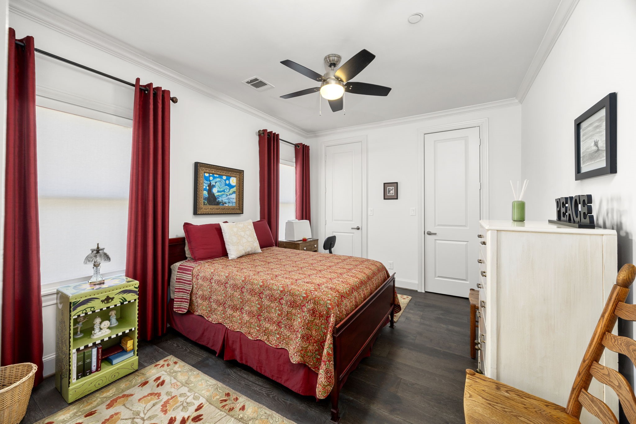 11 Robita Street Houston, TX 77019 - Photo 26 of 32 a bedroom with a bed and a chandelier