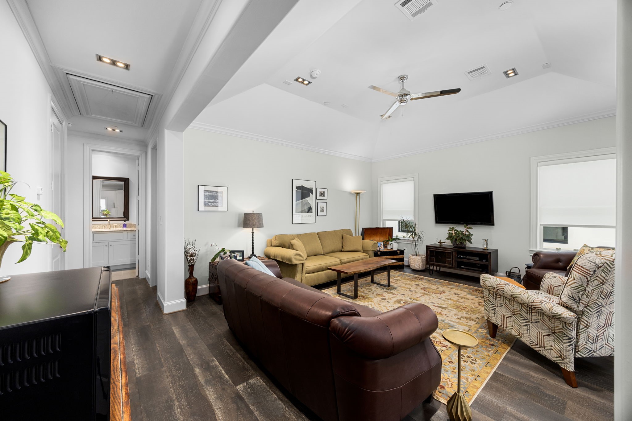 11 Robita Street Houston, TX 77019 - Photo 29 of 32 a living room with furniture and a flat screen tv