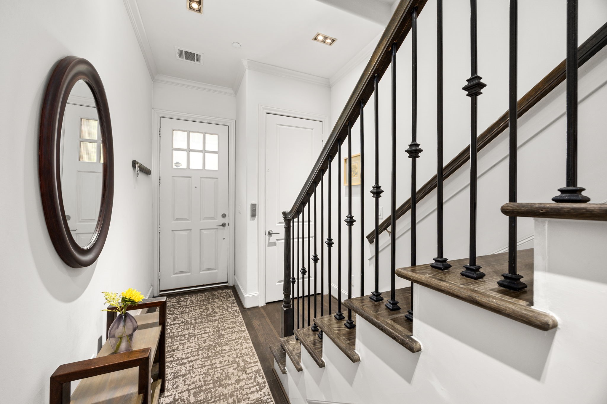 11 Robita Street Houston, TX 77019 - Photo 8 of 32 a view of an entryway with wooden floor and door