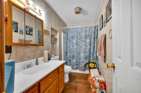 a bathroom with a sink double vanity and shower