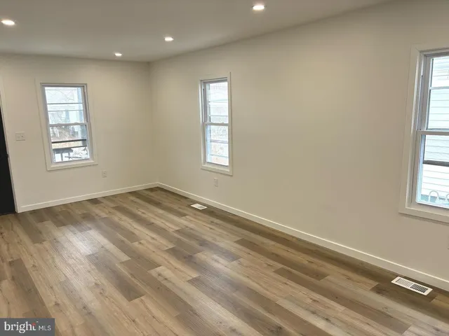 a view of empty room with windows