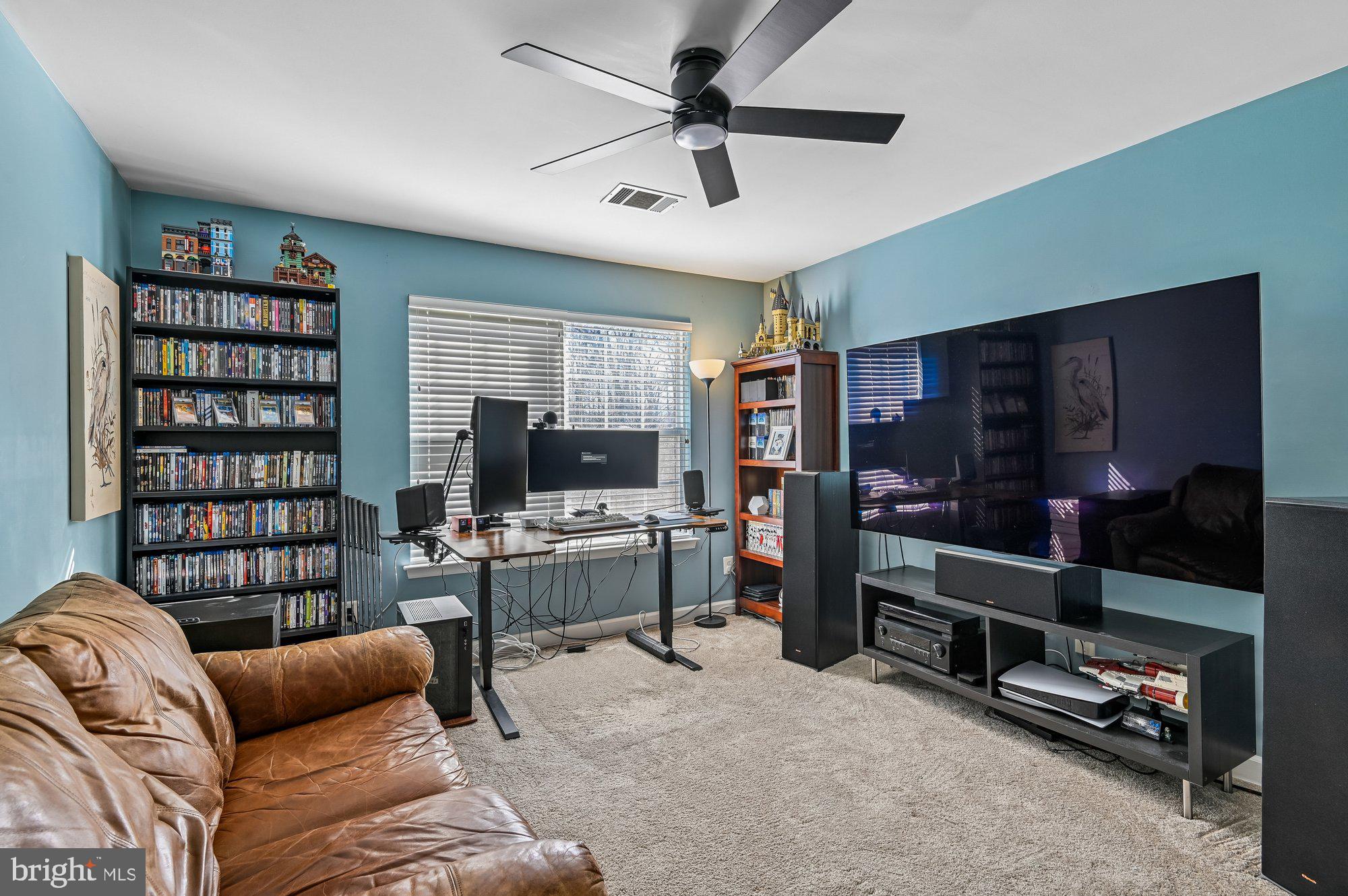 3225 Homewood Road Davidsonville, MD 21035 - Photo 22 of 33 a living room with furniture a flat screen tv and rug
