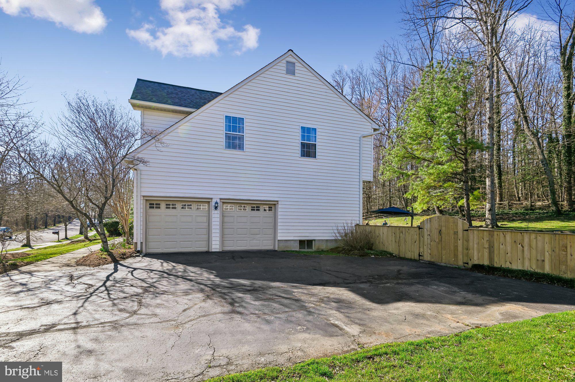 3225 Homewood Road Davidsonville, MD 21035 - Photo 32 of 33 a front view of a house with a yard and garage