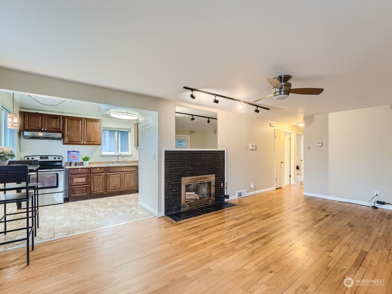 5019 South Roxbury Street Seattle, WA 98118 - Photo 3 of 11 a view of kitchen with sink microwave and stove