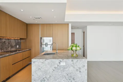 an empty room with sliding glass door and mirror