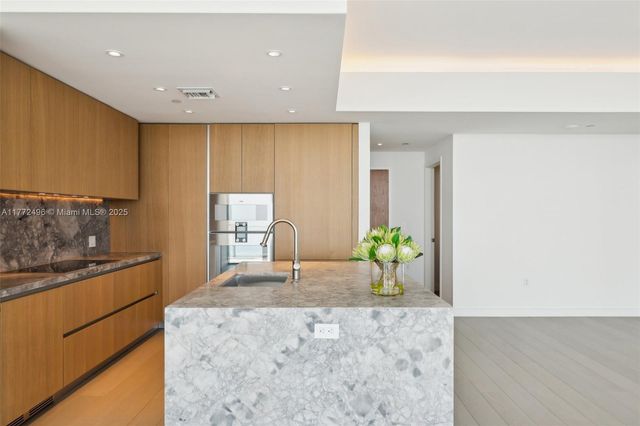 an empty room with sliding glass door and mirror