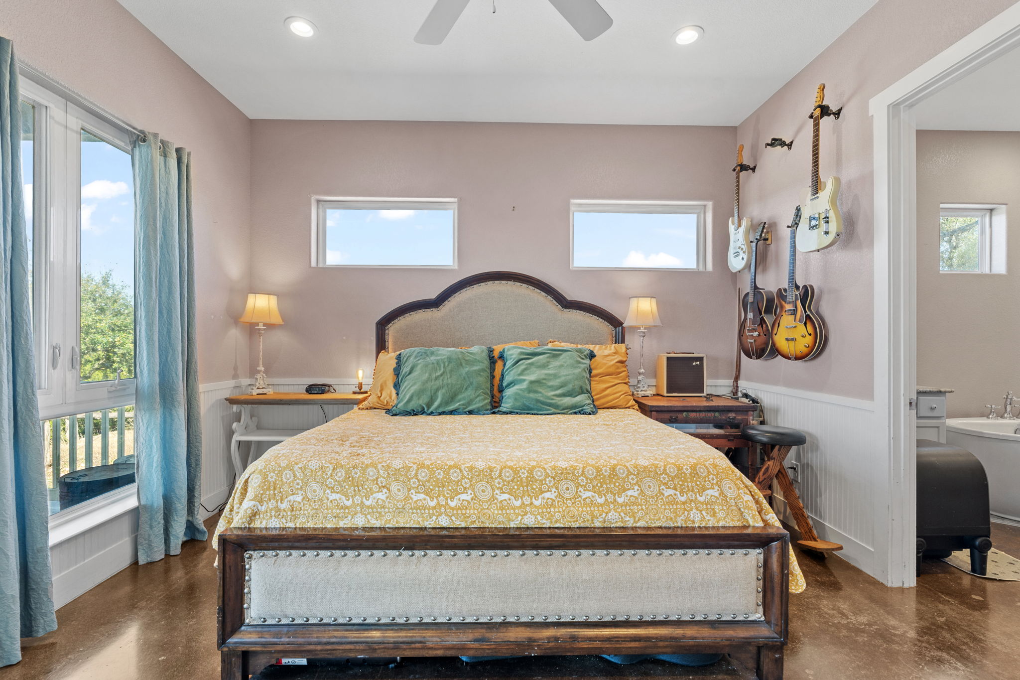 6350 Mt Sharp Road, Unit B Wimberley, TX 78676 - Photo 11 of 34 a bedroom with a bed window and table