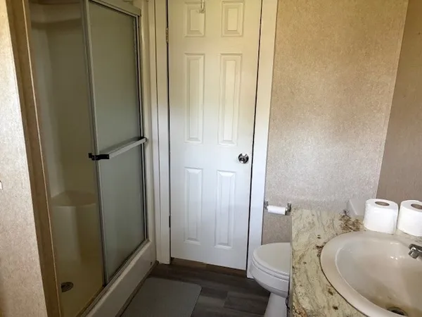 a bathroom with a sink and toilet