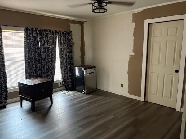 a view of a livingroom with furniture and hardwood floor