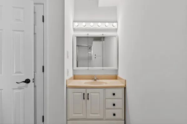 a bathroom with a sink and a mirror