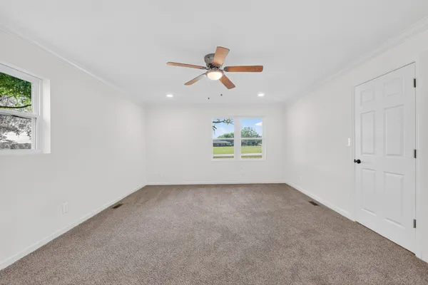 a view of a big room with carpet