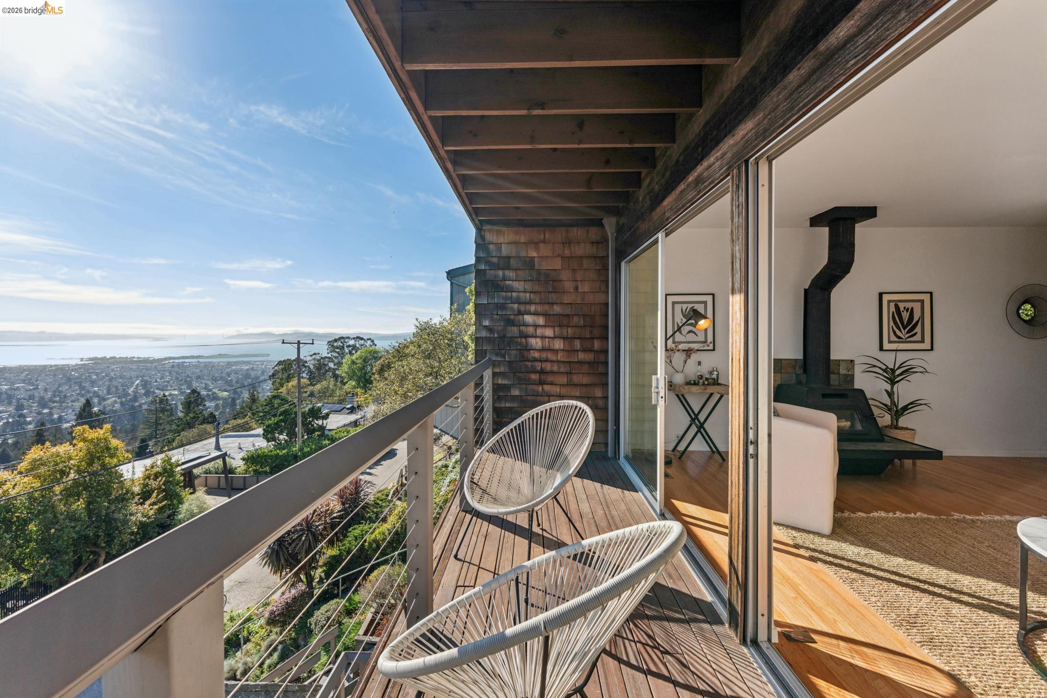 1155 Keeler Avenue Berkeley, CA 94708 - Photo 19 of 45 a view of a balcony with chair and wooden floor