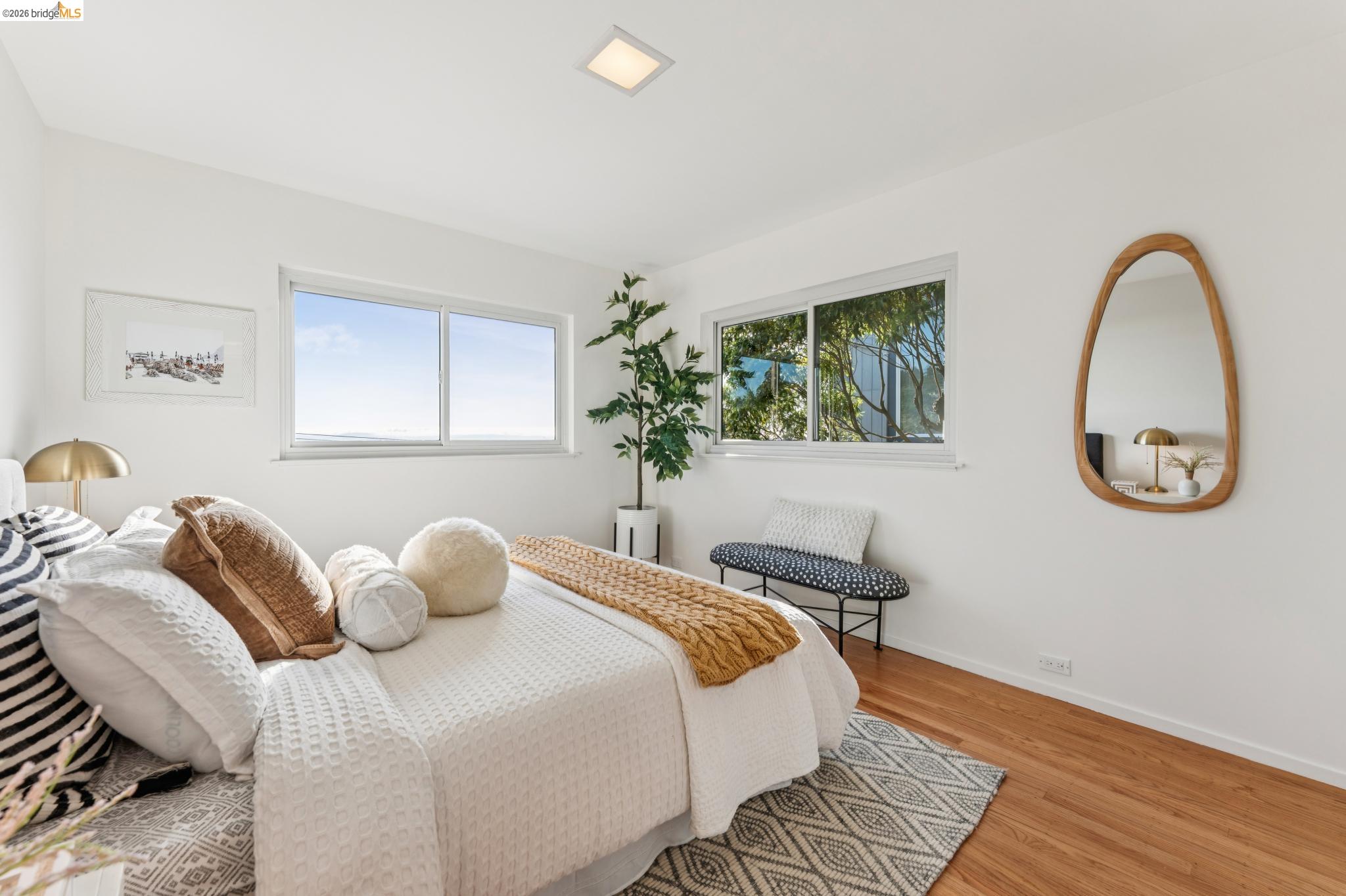 1155 Keeler Avenue Berkeley, CA 94708 - Photo 20 of 45 a bedroom with a bed and a potted plant