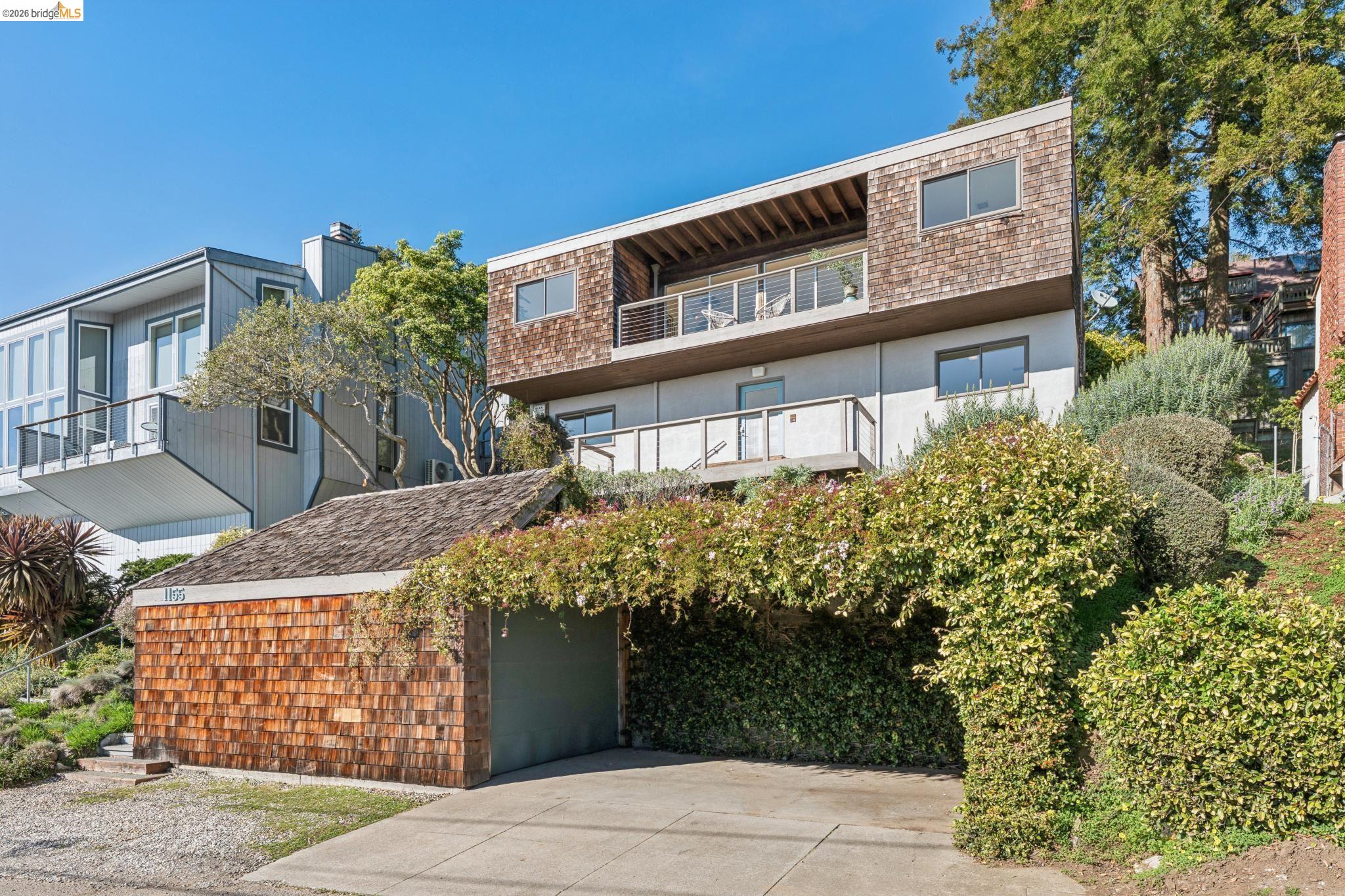 1155 Keeler Avenue Berkeley, CA 94708 - Photo 2 of 45 a front view of a house with a yard