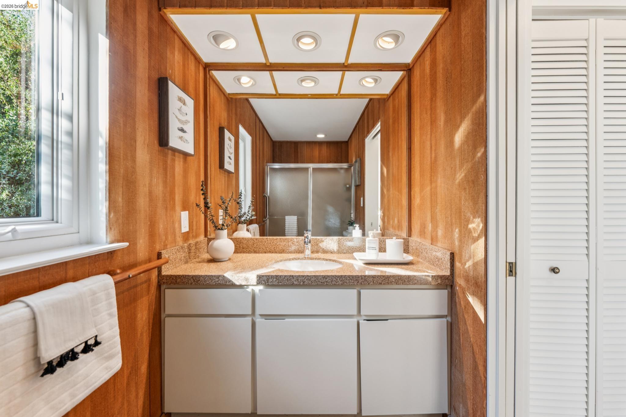 1155 Keeler Avenue Berkeley, CA 94708 - Photo 25 of 45 a bathroom with a sink and a mirror