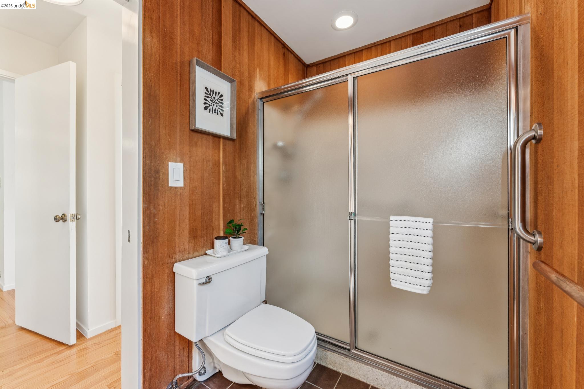 1155 Keeler Avenue Berkeley, CA 94708 - Photo 26 of 45 a bathroom with a shower a toilet and a sink