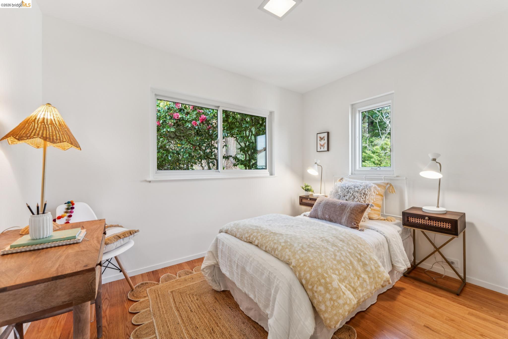 1155 Keeler Avenue Berkeley, CA 94708 - Photo 36 of 45 a bedroom with a bed a lamp and a window