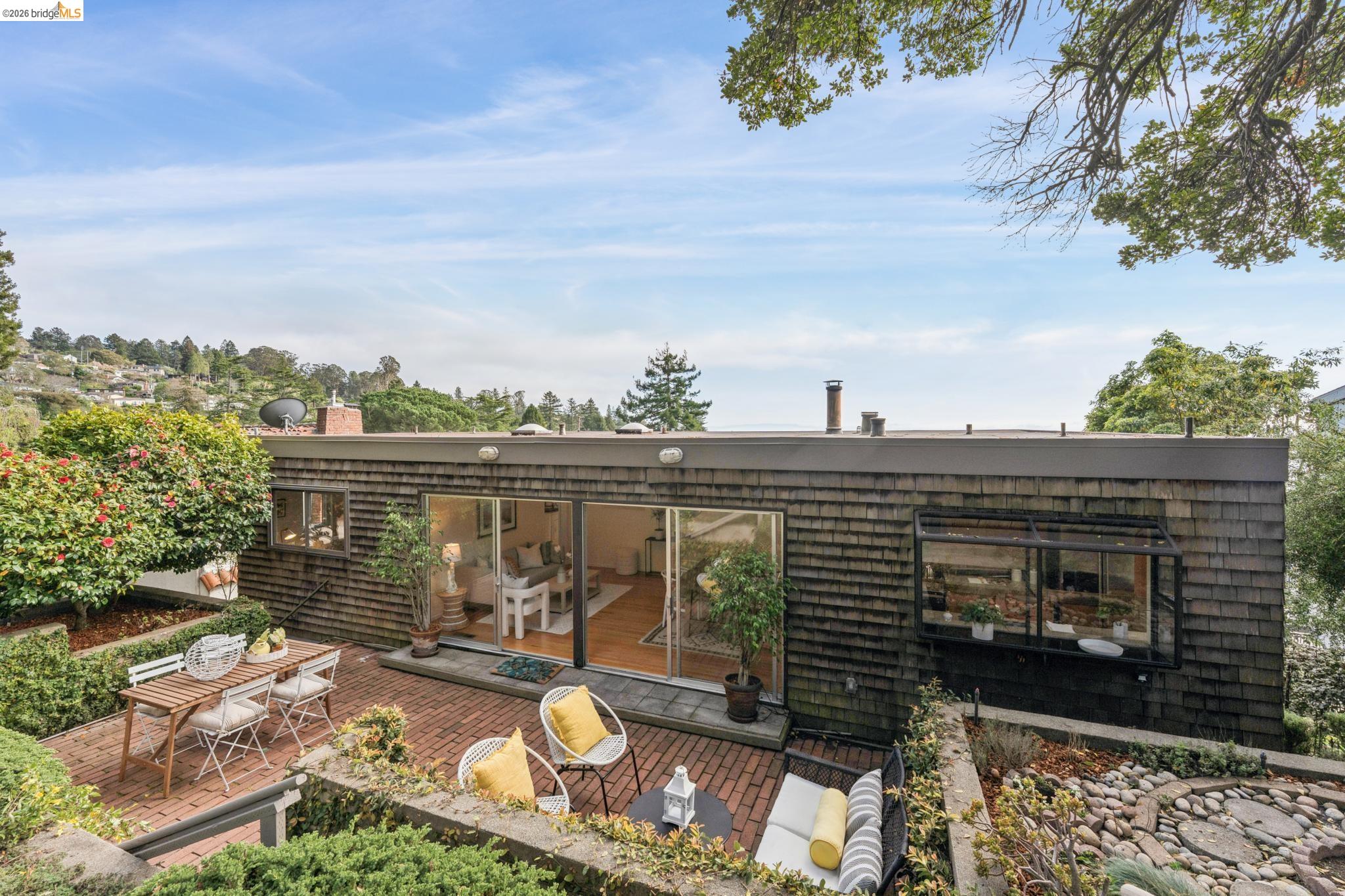1155 Keeler Avenue Berkeley, CA 94708 - Photo 42 of 45 a view of a balcony with two chairs and a table