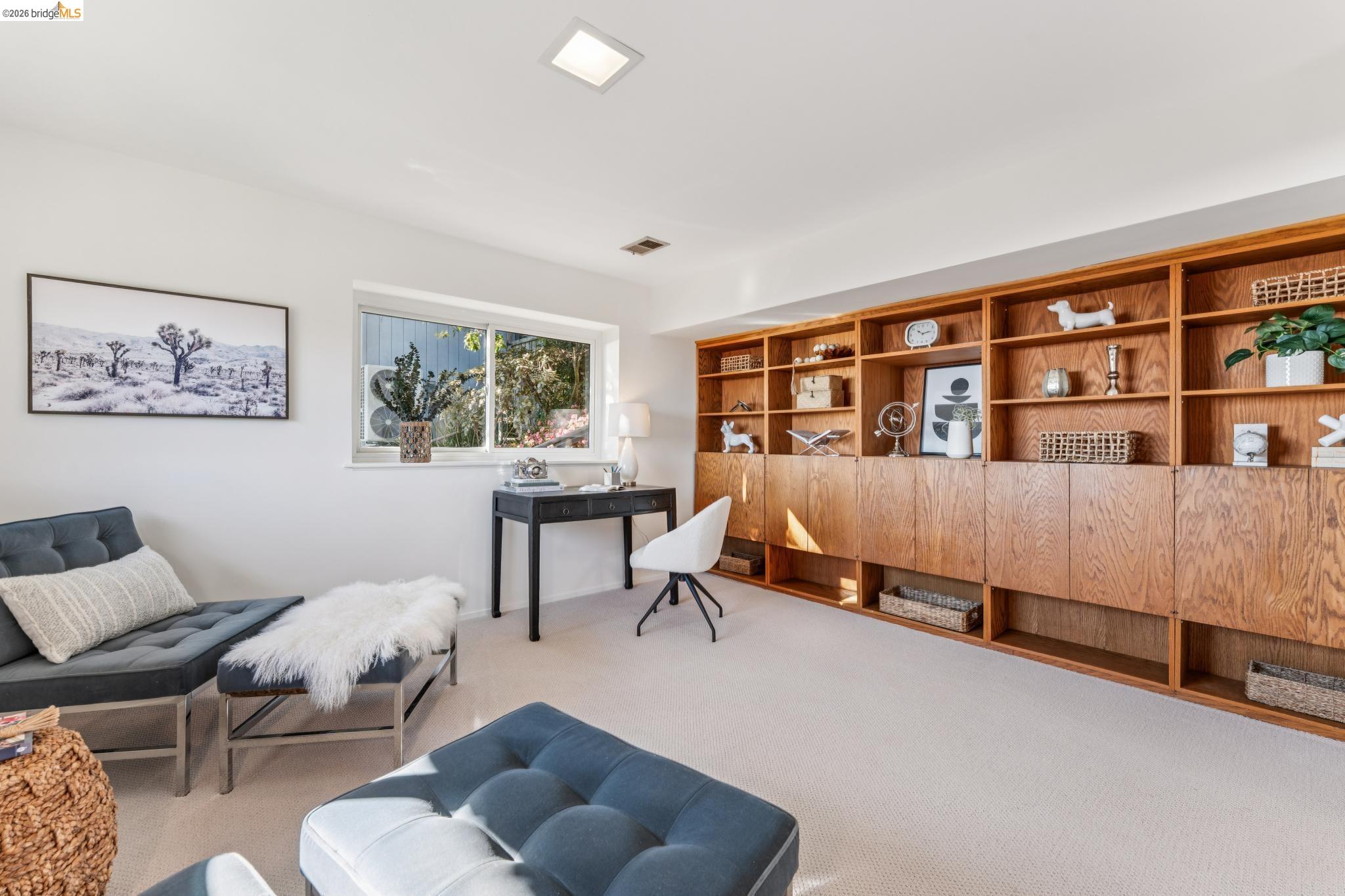1155 Keeler Avenue Berkeley, CA 94708 - Photo 10 of 45 a bedroom with furniture and a book shelf