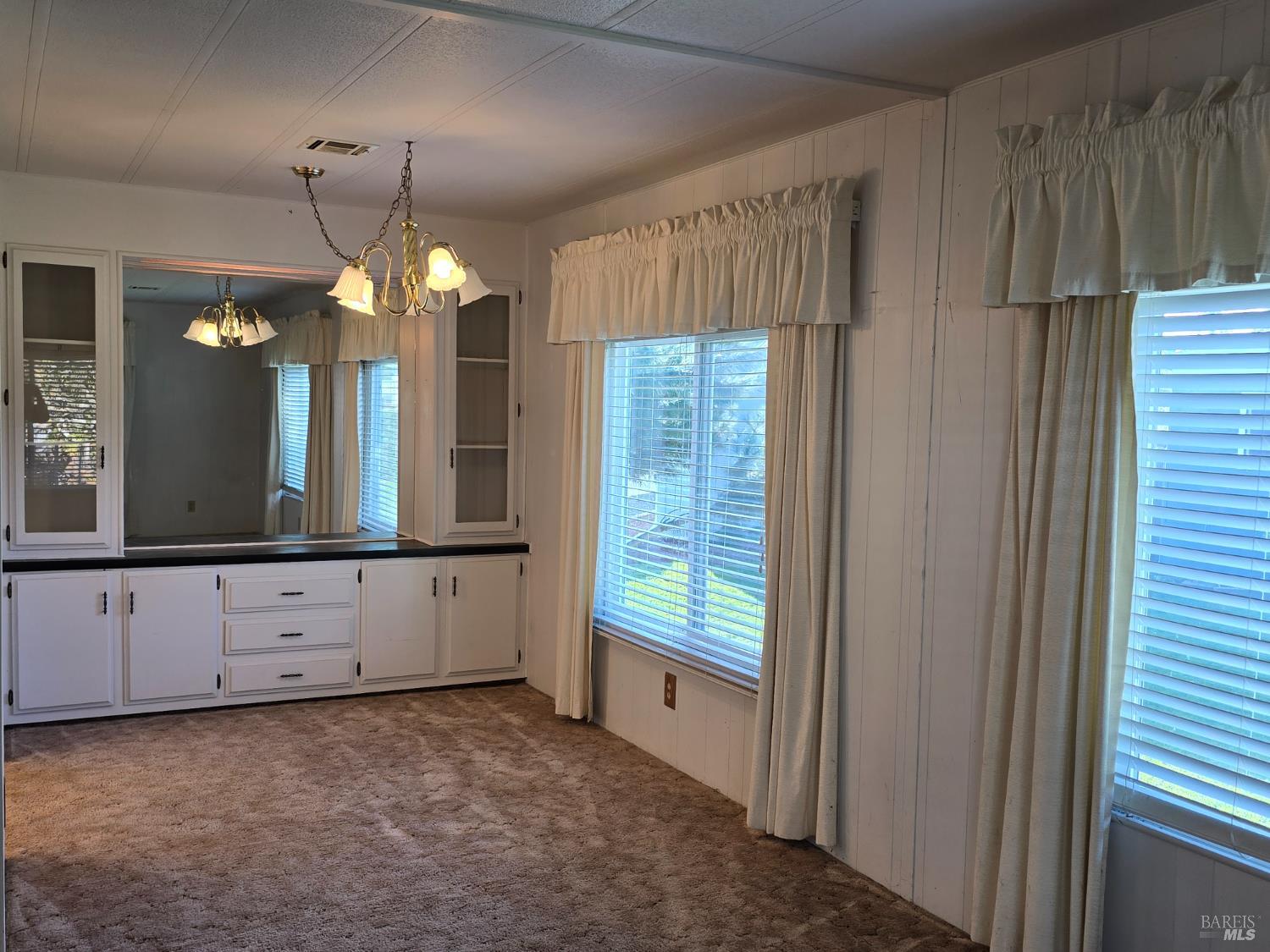 233 Apple Lane Rohnert Park, CA 94928 - Photo 13 of 17 a view of a kitchen with chandelier and window