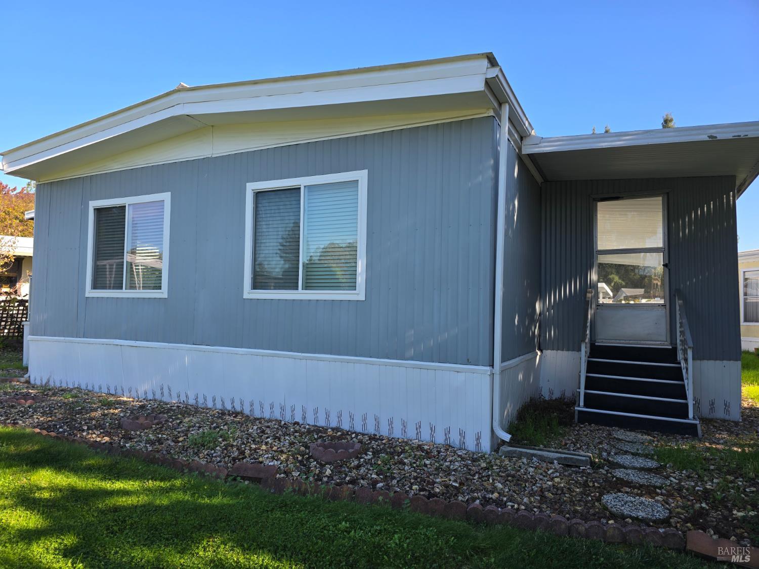 233 Apple Lane Rohnert Park, CA 94928 - Photo 5 of 19 a front view of a house with a yard