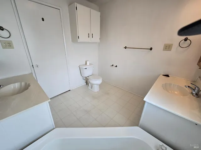 a bathroom with a sink and toilet