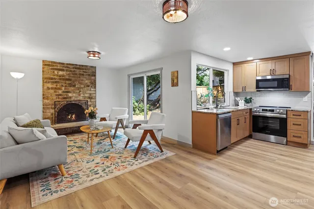 a living room with furniture and a fireplace