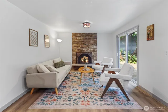 a living room with furniture and a rug