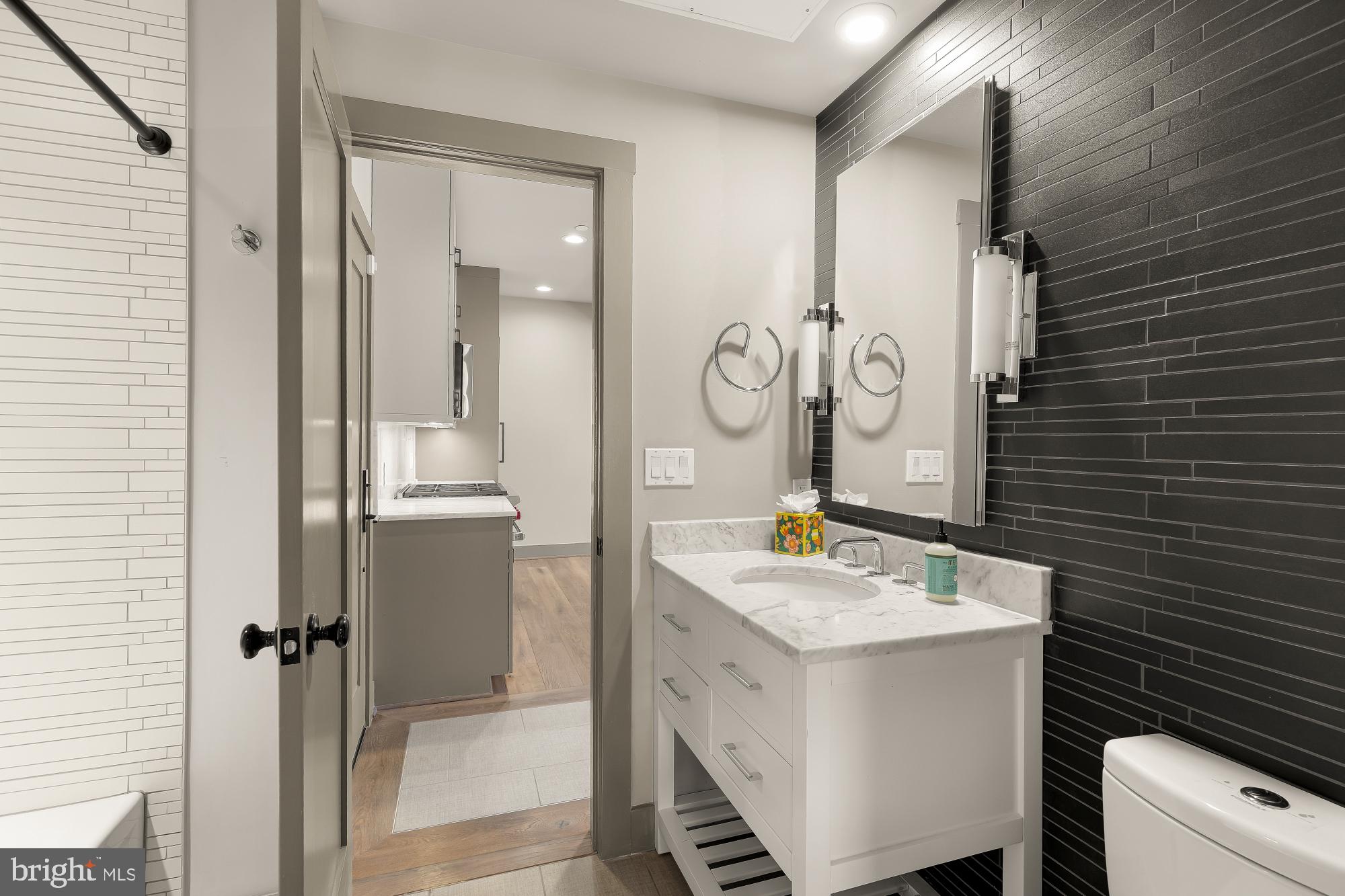 3220 Grace Street Northwest, Unit 5 Washington, DC 20007 - Photo 15 of 31 a bathroom with a sink a toilet and shower