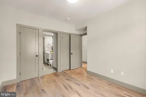 a view of hallway with wooden floor