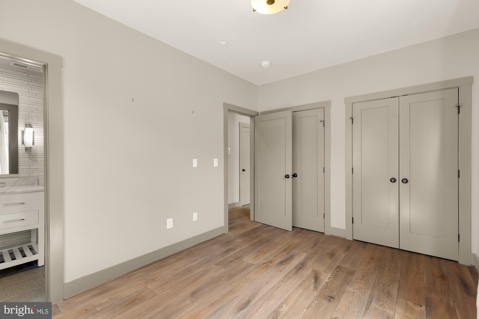 3220 Grace Street Northwest, Unit 5 Washington, DC 20007 - Photo 24 of 31 a view of an empty room and wooden floor
