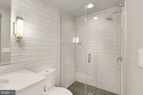 a bathroom with a sink and toilet