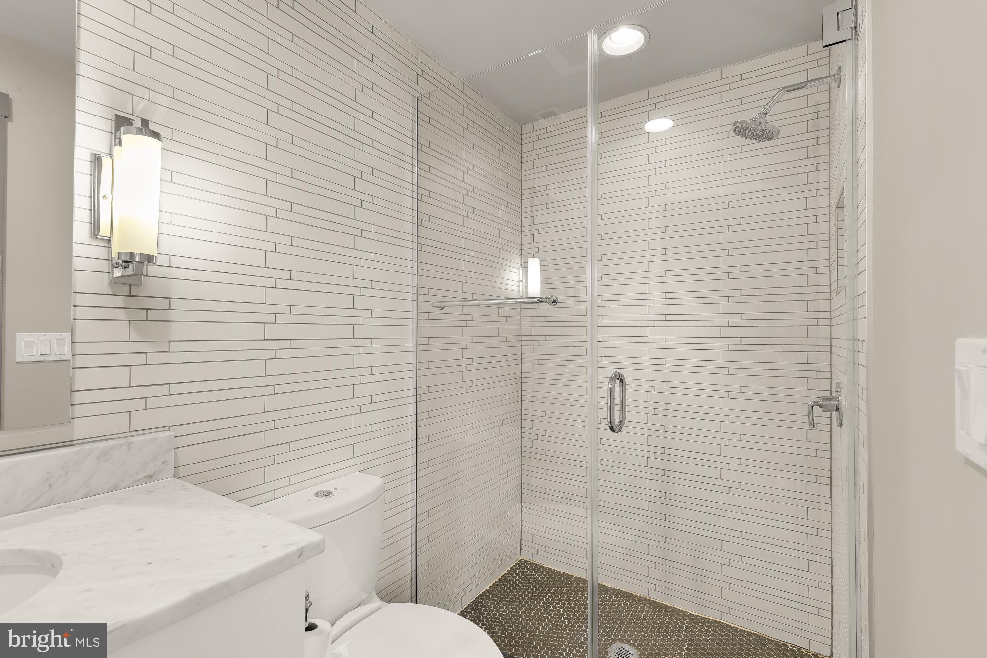 3220 Grace Street Northwest, Unit 5 Washington, DC 20007 - Photo 26 of 31 a bathroom with a sink and toilet