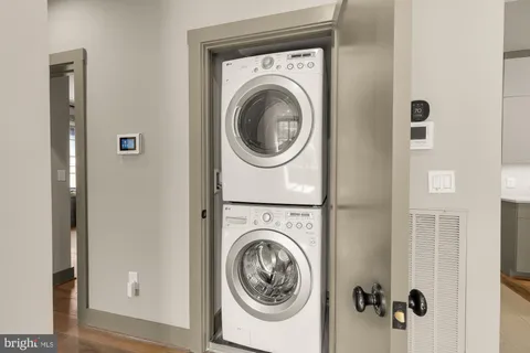 a view of a hallway with washer and dryer