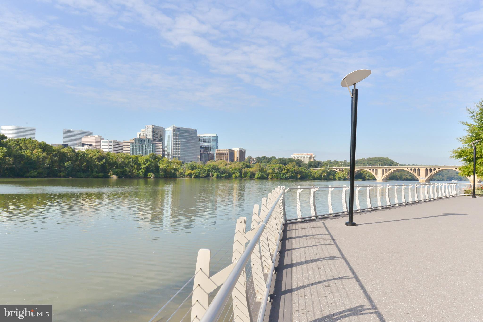 3220 Grace Street Northwest, Unit 5 Washington, DC 20007 - Photo 30 of 31 a view of a lake with a city skyline in the background