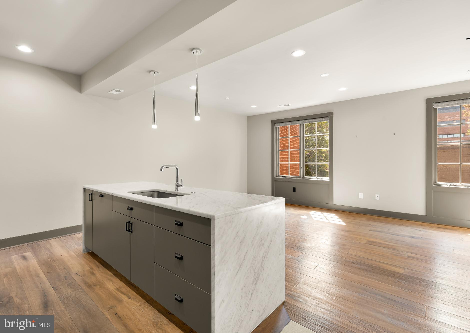 3220 Grace Street Northwest, Unit 5 Washington, DC 20007 - Photo 3 of 31 a view of a kitchen counter space with wooden floor