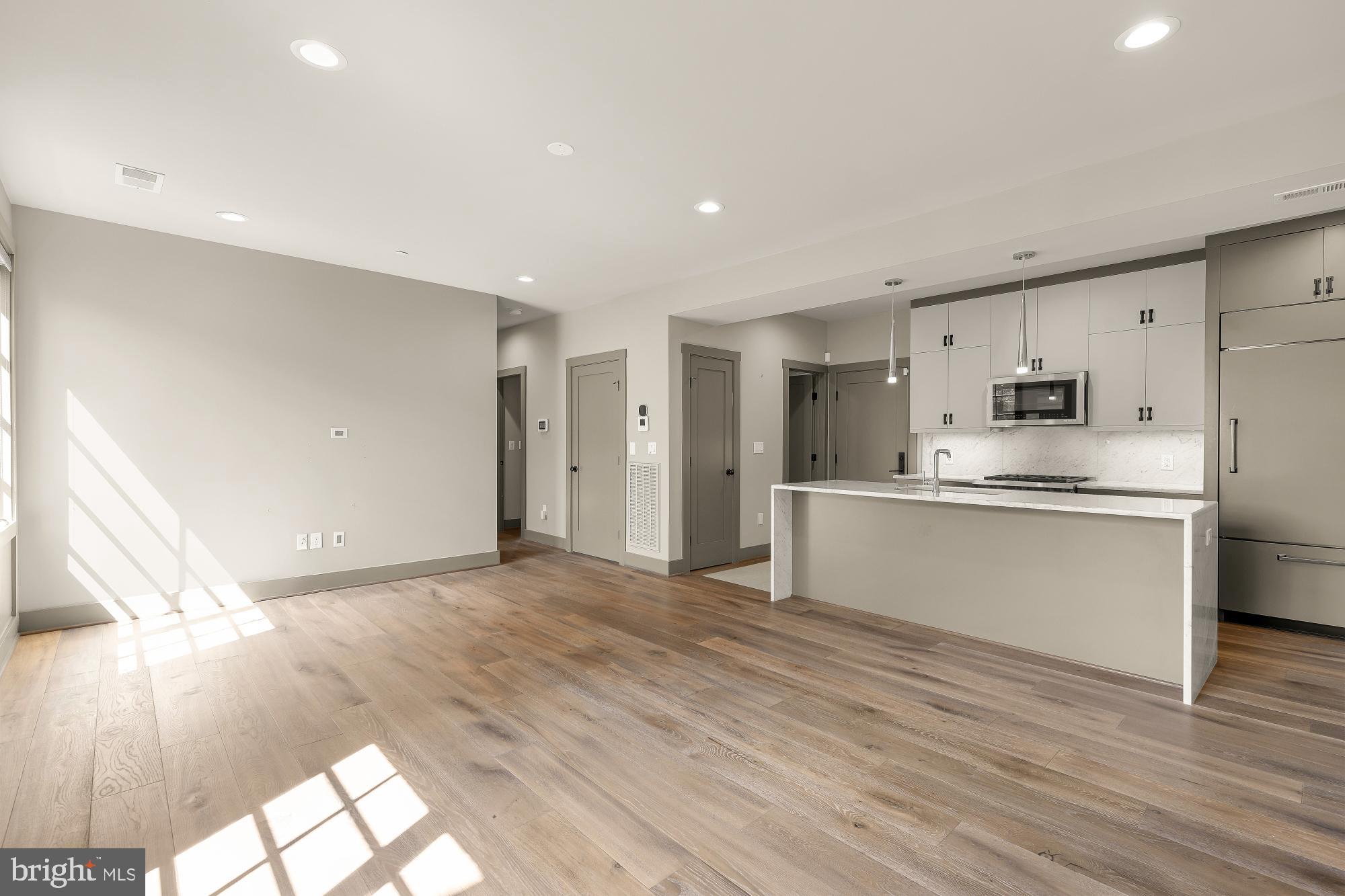 3220 Grace Street Northwest, Unit 5 Washington, DC 20007 - Photo 10 of 31 a view of kitchen with wooden floor