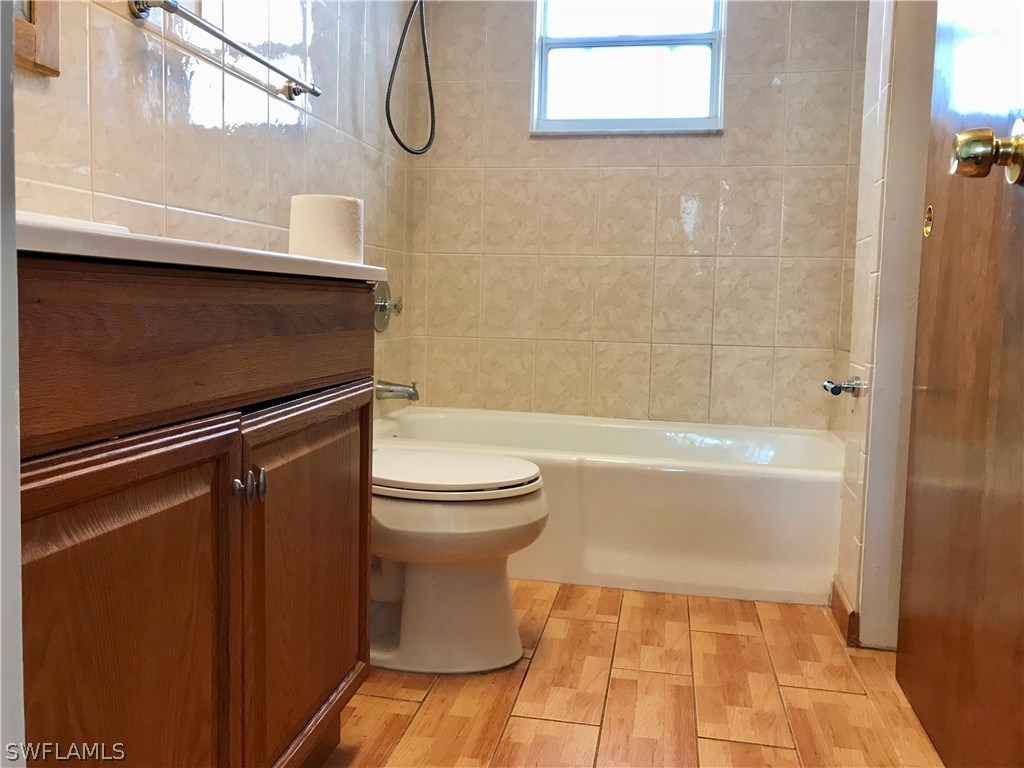 7658 Laurel Valley Road Fort Myers, FL 33967 - Photo 11 of 14 a bathroom with a toilet and a shower