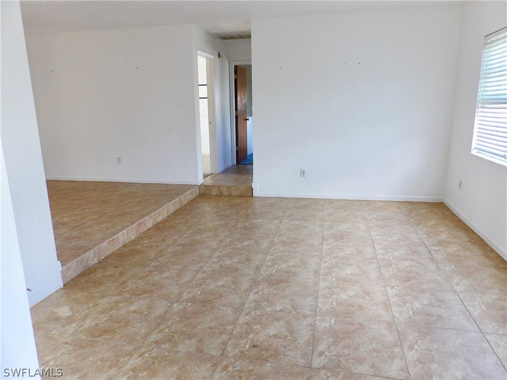 7658 Laurel Valley Road Fort Myers, FL 33967 - Photo 7 of 14 an empty room with windows