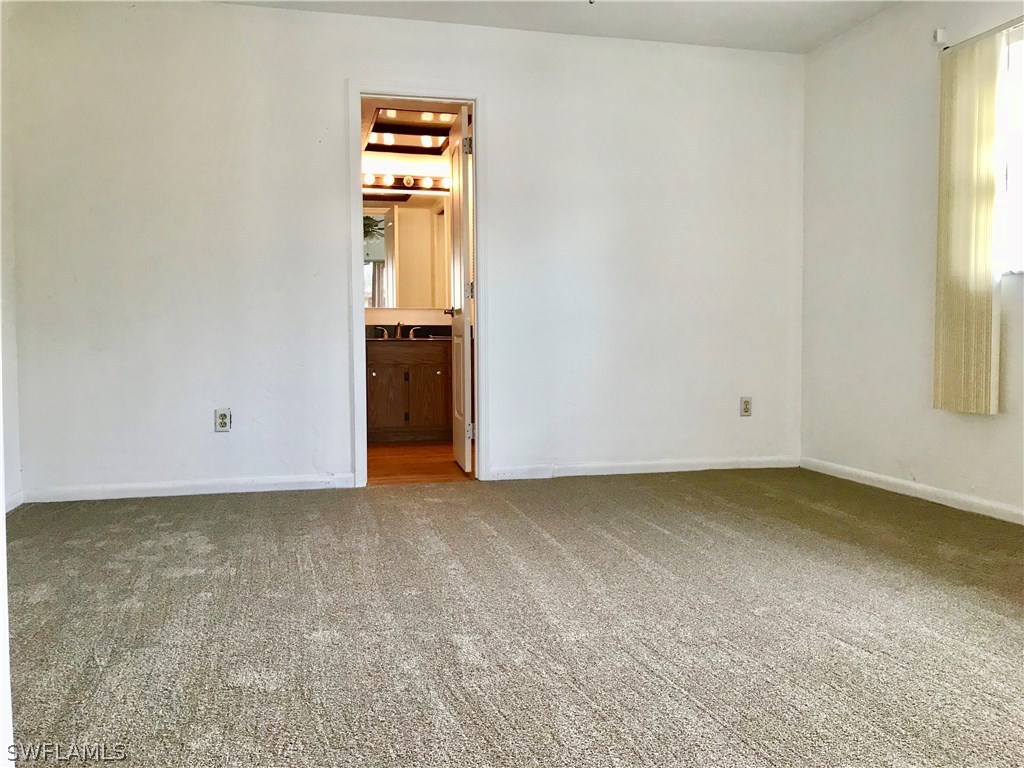 7658 Laurel Valley Road Fort Myers, FL 33967 - Photo 8 of 14 an empty room with windows