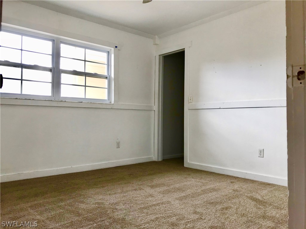 7658 Laurel Valley Road Fort Myers, FL 33967 - Photo 9 of 14 an empty room with a window