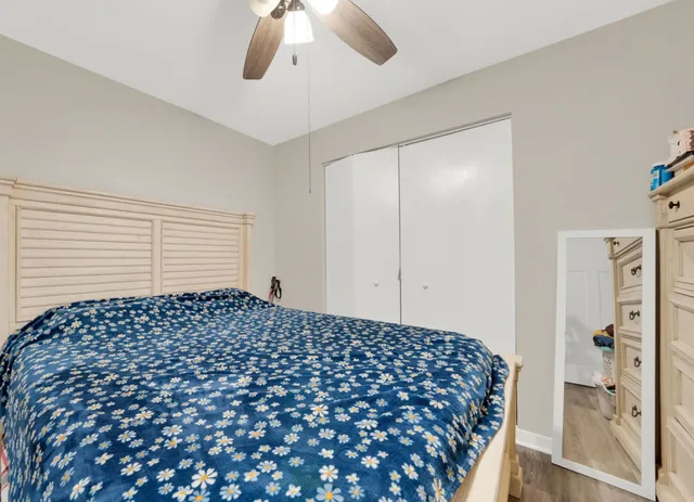 a bedroom with bed and window