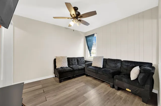 a living room with couches and a coffee table