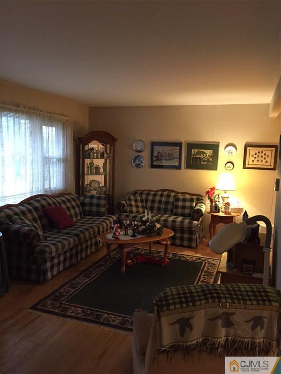21 Mercer Road Old Bridge, NJ 08857 - Photo 14 of 25 a living room with furniture a air conditioner and a window