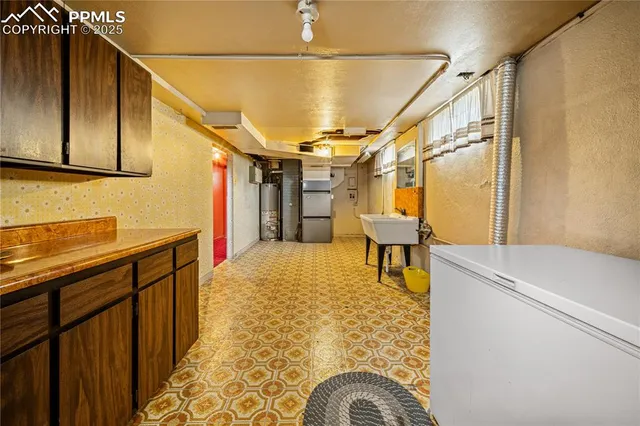 a hallway with a stove and a refrigerator