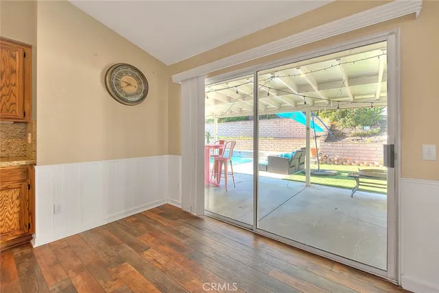 an empty room with floor to ceiling windows and wall