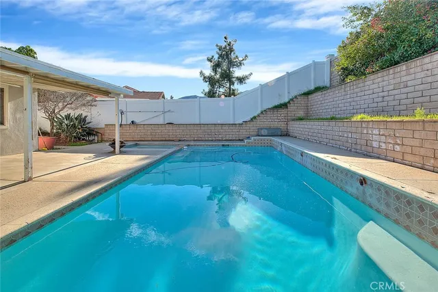 a view of a pathway both side of the house