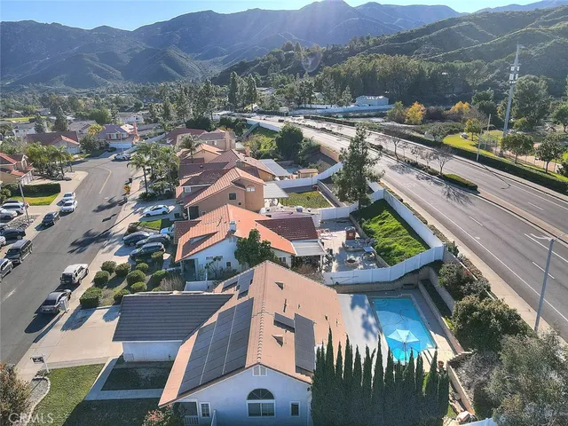 an aerial view of residential houses with outdoor space