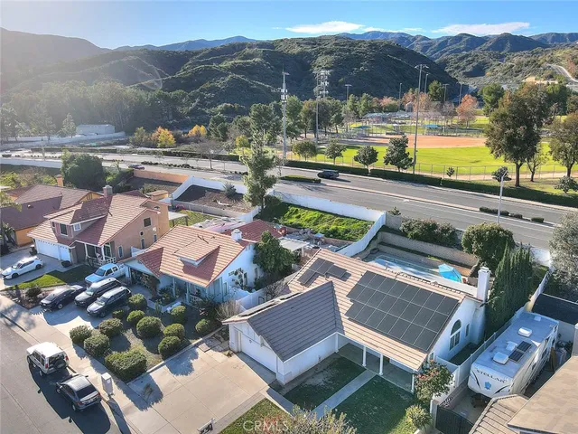 a view of a swimming pool with a yard
